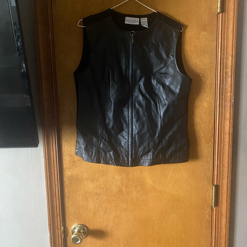 Jaclyn Smith black leather and sweater vest